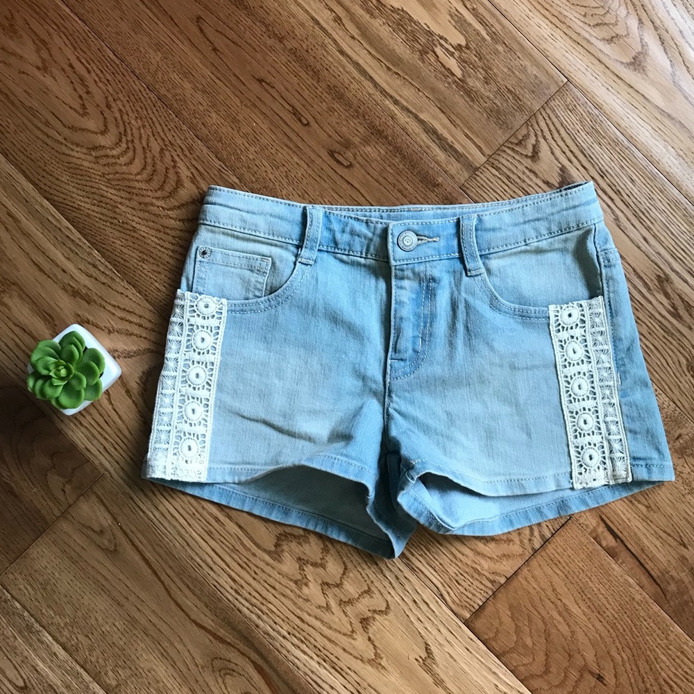 Light washed jean shorts with lace side!
